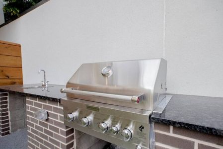 Stainless steel BBQ grill on-site — fire it up for an outdoor cookout.