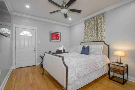 Restful master bedroom w/ crisp white bedding & easy access to a private en-suite bath.