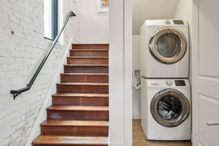 Convenient in-unit laundry tucked just off the stairway—perfect for extended stays and fresh outfits.