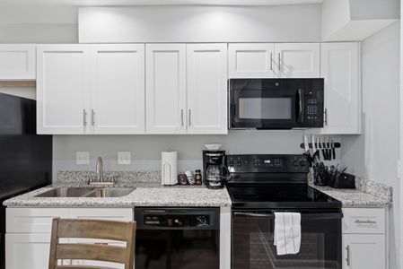 Open kitchen w/ bar seating — great for cooking & catching up together.