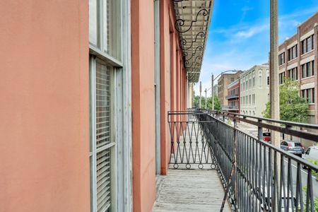 Sip your morning coffee on the balcony overlooking Girod Street.
