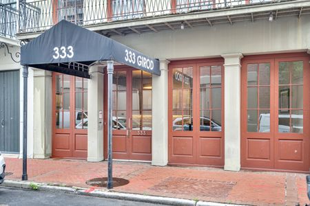 Step through elegant wood & glass doors into your French Quarter retreat.