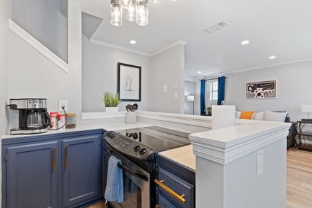 Kitchen opening up to the living room — great flow for entertaining.
