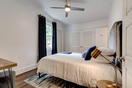 Inviting queen bed dressed in crisp linens — rest easy after a full day out.