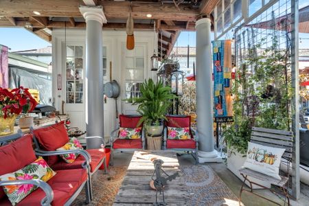 Lush courtyard lounge draped in greenery — perfect for unwinding.