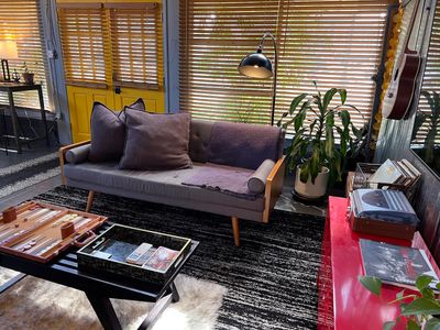 Kick back on the sofa — stream, spin records, or challenge someone to backgammon.