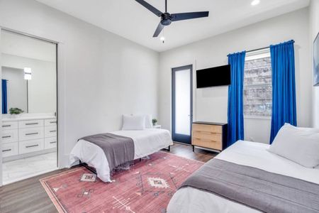 Another angle of the twin-bed upstairs room — spacious & full of natural light.