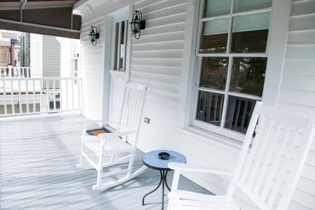 Breezy balcony w/ a serene outdoor view.