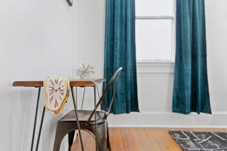 Step into bedroom 2 through a welcoming entryway w/ warm natural light.