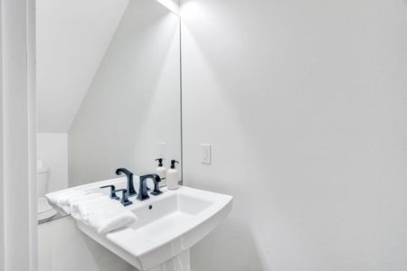 Clean downstairs half bath — compact & convenient for guests.