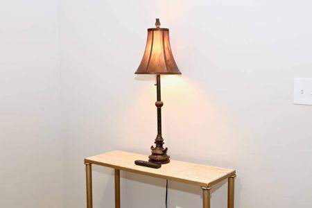 Warm bedside lamp casting a cozy glow — perfect for winding down.