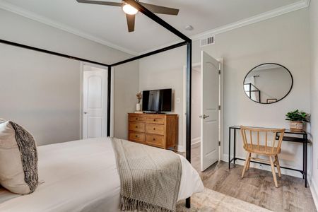 Sun-filled bedroom w/ a desk nook — great for unwinding or getting work done.