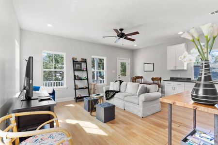 Sun-filled living room w/ plush seating — the perfect spot to relax & unwind.