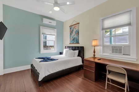 Sun-filled bedroom w/ crisp bedding for a peaceful night's rest.