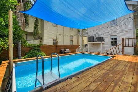 Pool nestled in a lush, fenced backyard — your own quiet oasis.