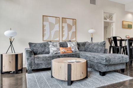 Lounge on the sofa beneath warm art & colorful accent pillows.