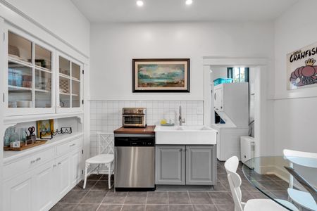 Charming bathroom vignette w/ curated décor & warm accents.