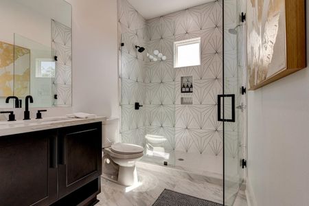 Spa-like upstairs bath w/ walk-in shower & beautiful patterned tile.
