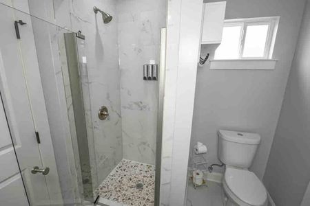 Clean, functional bathroom w/ shower & toilet — everything you need for a comfortable stay.