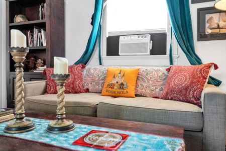 Relaxed living space w/ signature Book NOLA touches throughout.