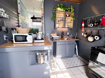 Compact kitchen w/ everything you need to whip up a home-cooked meal.