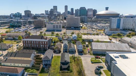 Aerial view of the surrounding area & city streets.