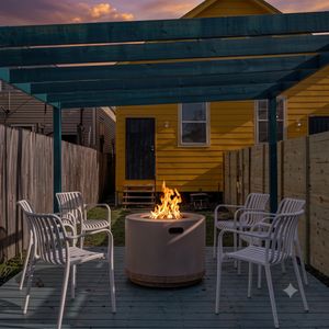 Shaded outdoor patio w/ a dining table — great for al fresco meals or morning coffee.