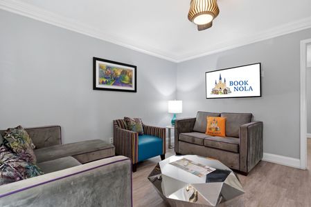 Cheerful sitting room w/ colorful accent chairs & a relaxed, social vibe.