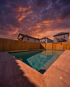Fully-fenced pool w/ a clean surround, toys & towels ready for a fun-filled afternoon.