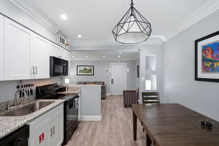 Unit 201 kitchen — cook, dine & settle in w/ everything you need.