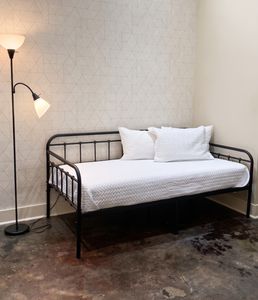 Comfortable bed with bedside lighting