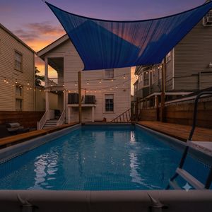 Shaded pool area viewed from above — cool, inviting & ready for a dip.