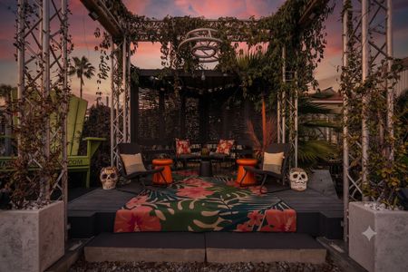 String-lit courtyard perfect for gathering after dark.