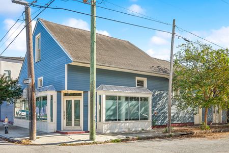 Charming exterior w/ classic architecture & blue siding.
