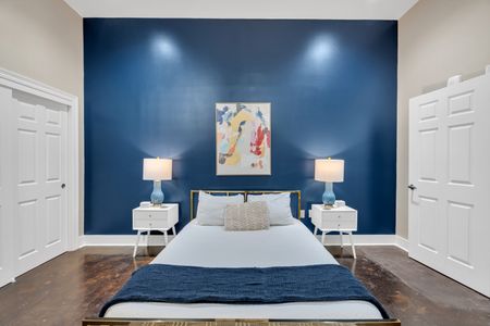 Statement art above a hotel-quality bed