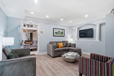 Airy living area w/ Smart TV & stylish, modern touches.