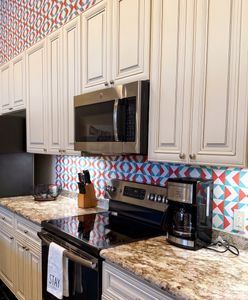 Sleek kitchen with colorful backsplash