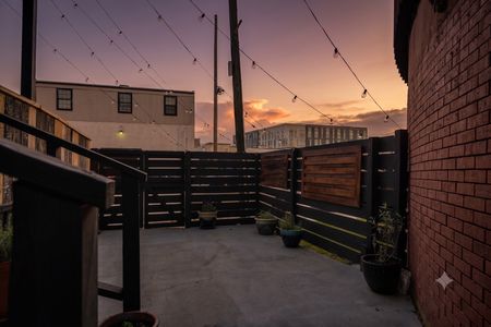 Open-air exterior w/ fenced space offering a private, easy-going outdoor feel.