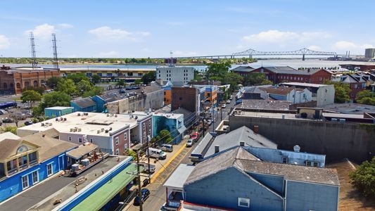 Frenchmen Street below, Mississippi River beyond