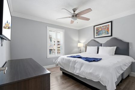 Light-filled bedroom w/ a bed & Smart TV — restful & relaxed.
