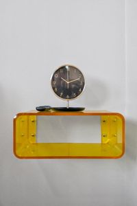 Fun retro touch w/ a bold yellow console & statement wall clock