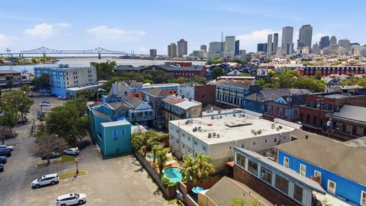 Wide rooftop view capturing the city's unique layout & energy.