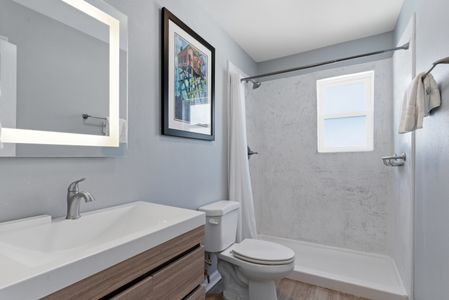 Unit 205 – Modern bathroom w/ clean finishes & a sleek, refreshing feel.