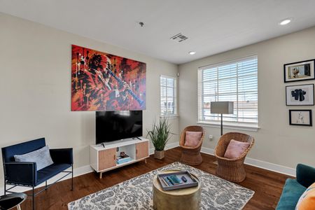 Cozy lounge with accent chairs and a Smart TV