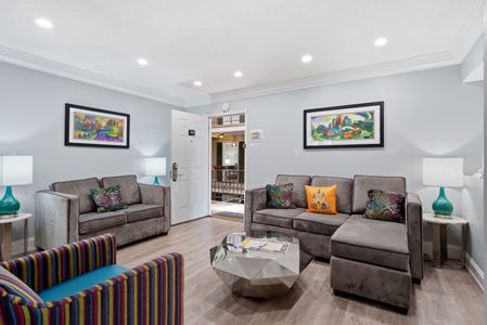 Bright, open living area with cozy seating & a welcoming vibe.