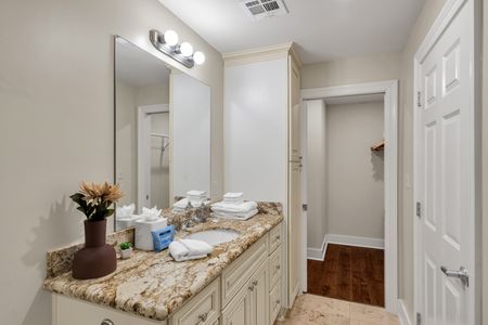 Fresh flowers and granite at the vanity
