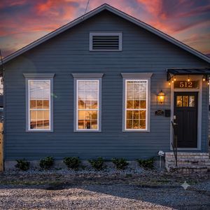 Classic blue cottage exterior — a charming Uptown gem full of character.
