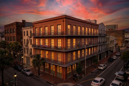 Iconic wrought-iron balconies on a historic corner building straight out of a postcard.