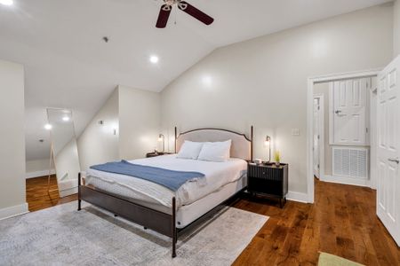 Iron bed under a vaulted ceiling