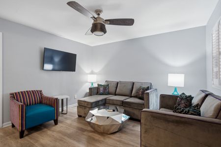 Airy living area w/ plush sofa & flatscreen TV to kick back after a long day.